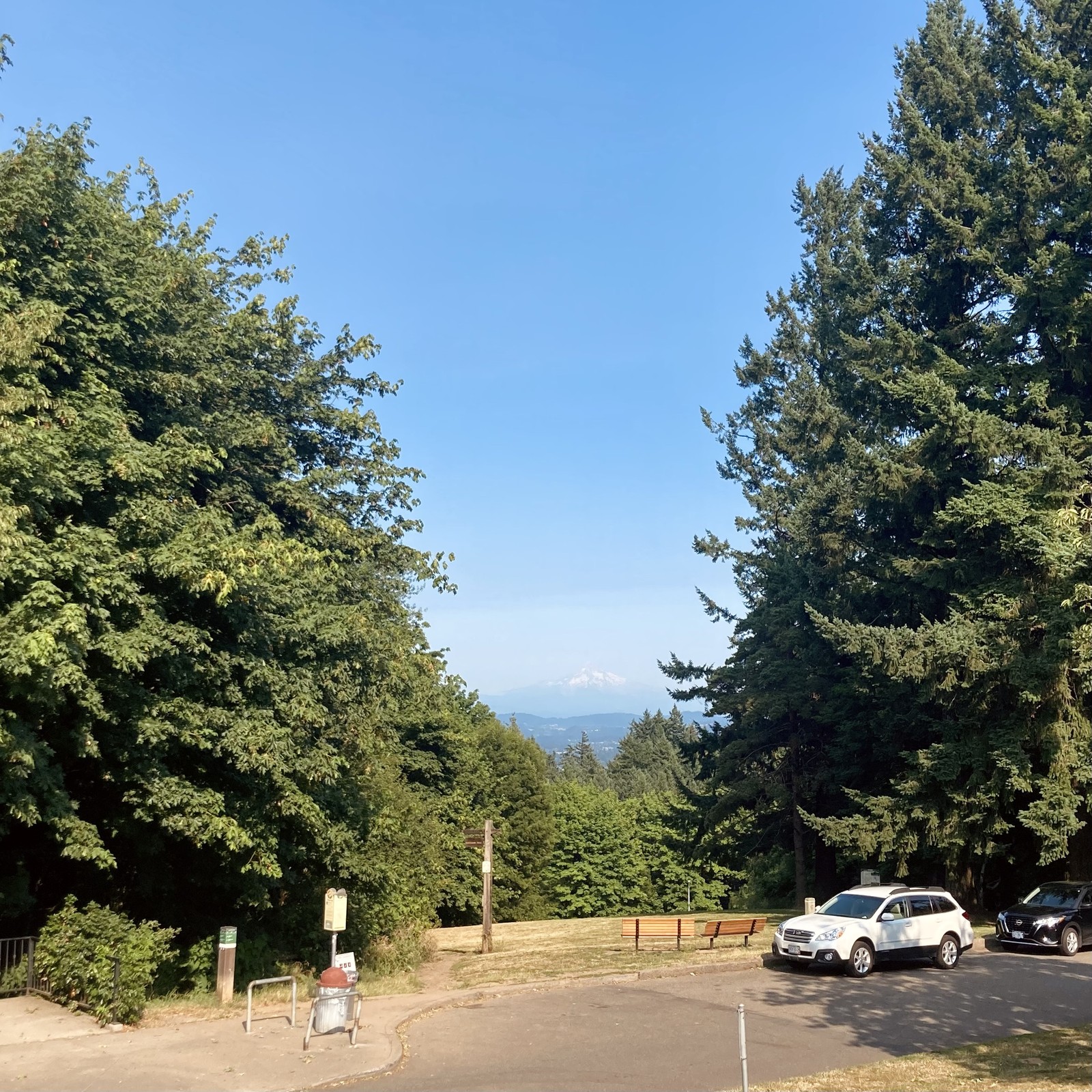 Mt. Hood seen from Council Crest Park. A moderate haze from a nearby paper mill fire obscures the otherwise clear view on a very hot & dry day