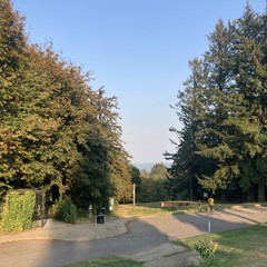 Wildfire haze obscures Mt. Hood in an otherwise blank sky. Near sunset, long shadows fall toward the east