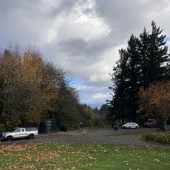 Mount hood is obscured by low clouds under a broken sky in a late November mid afternoon